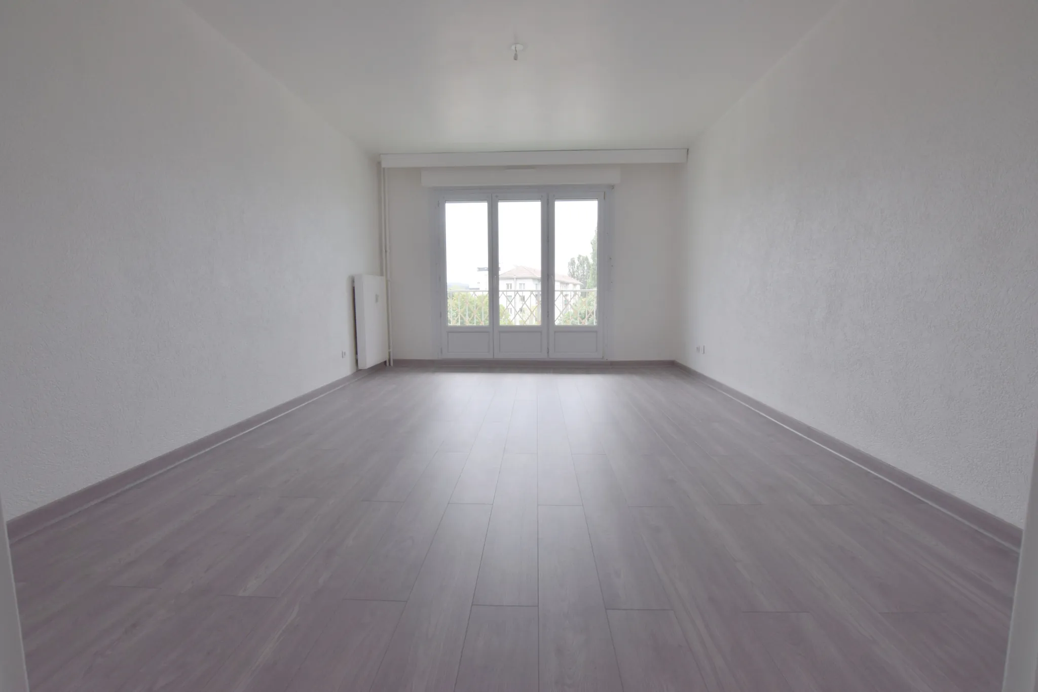 Appartement lumineux avec balcon, garage et cave à Sochaux 