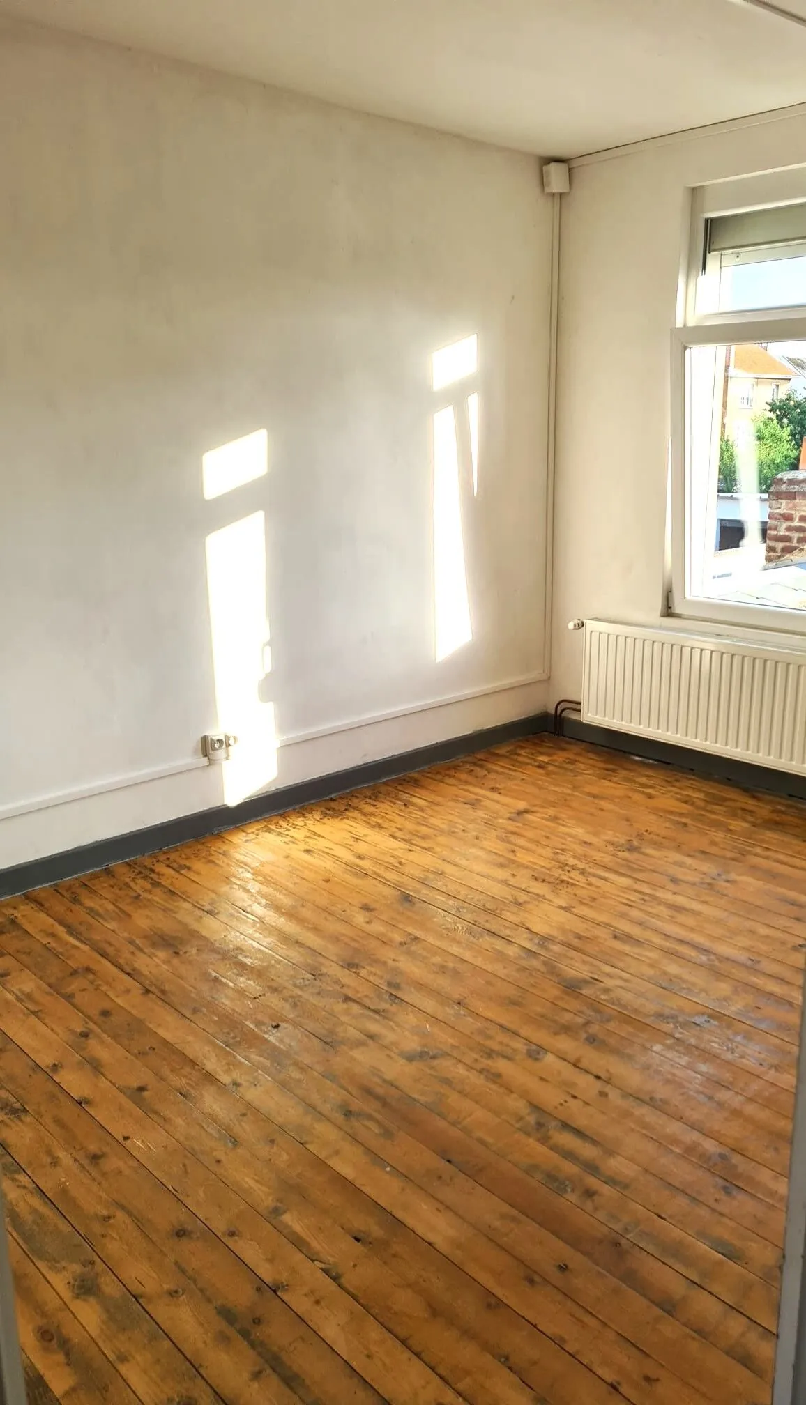 Maison semi-individuelle à vendre à Aulnoye-Aymeries avec garage et jardin clos 