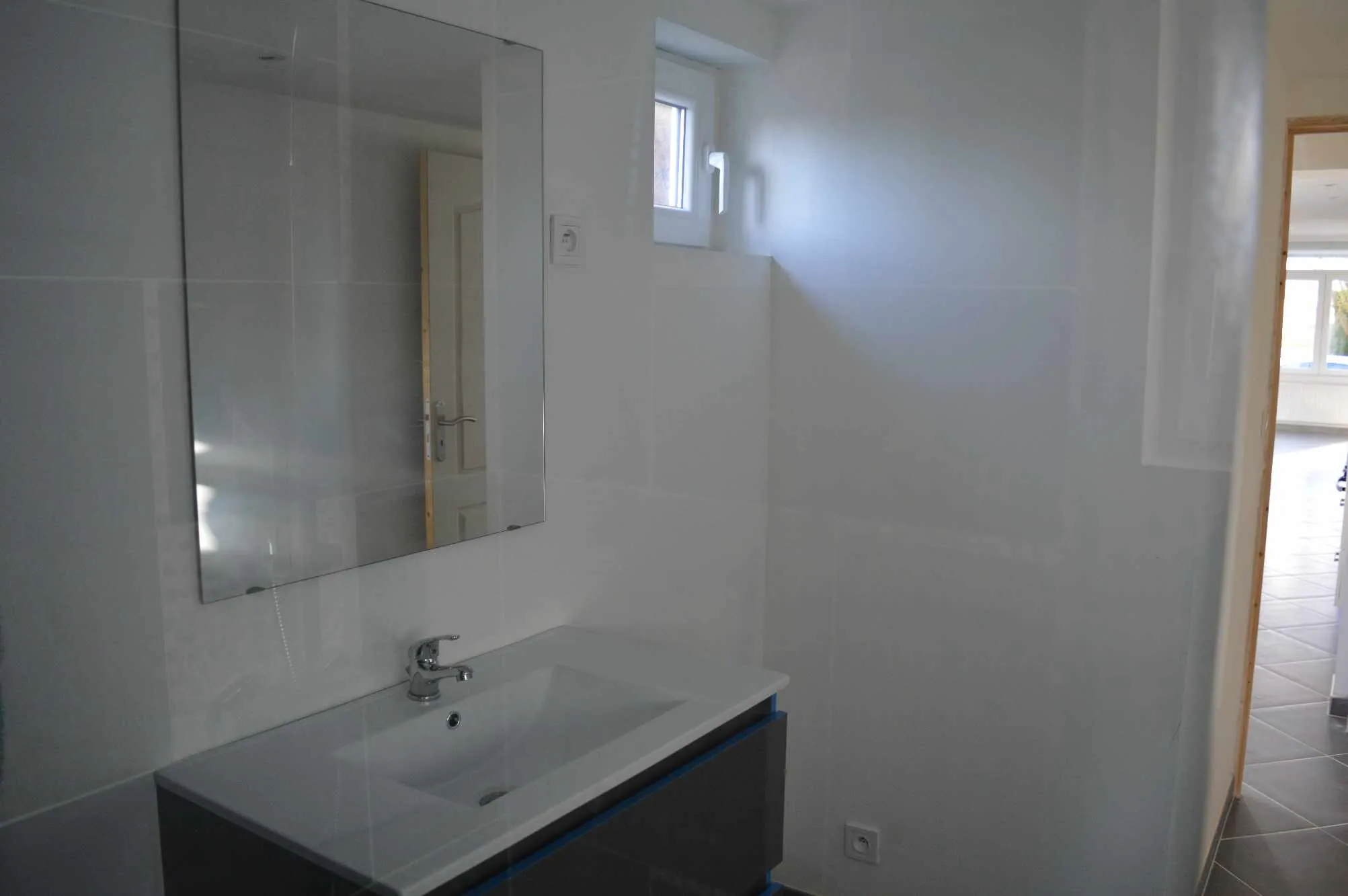 Maison semi-individuelle à vendre à Aulnoye-Aymeries avec garage et jardin clos 