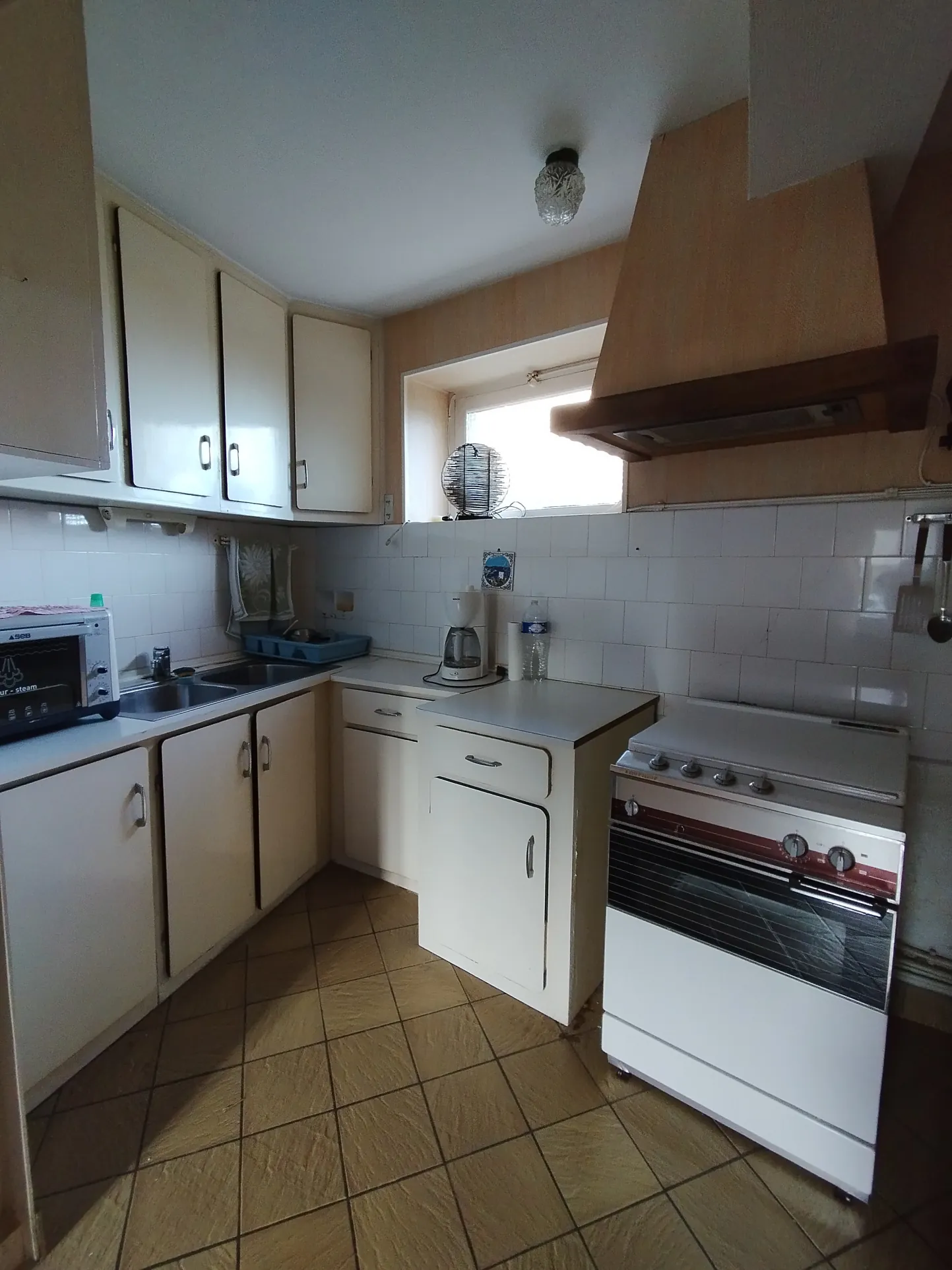 Maison familiale de 113 m² à Thiers avec 4 chambres, garage et cour 