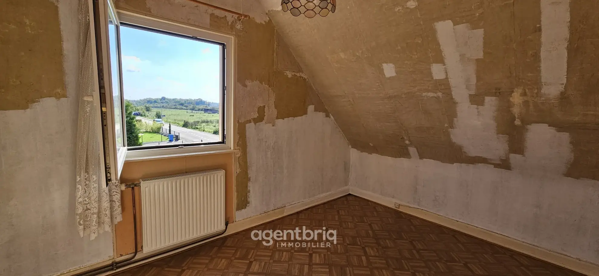 Maison mitoyenne à Wittelsheim avec vue sur les Vosges – Opportunité à rénover 
