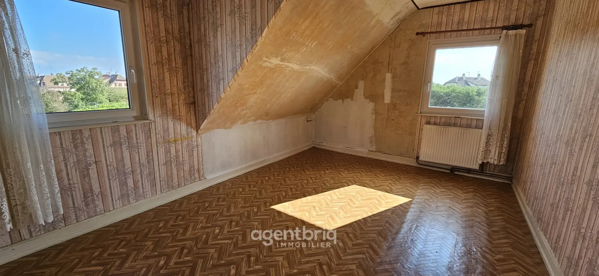 Maison mitoyenne à Wittelsheim avec vue sur les Vosges – Opportunité à rénover 