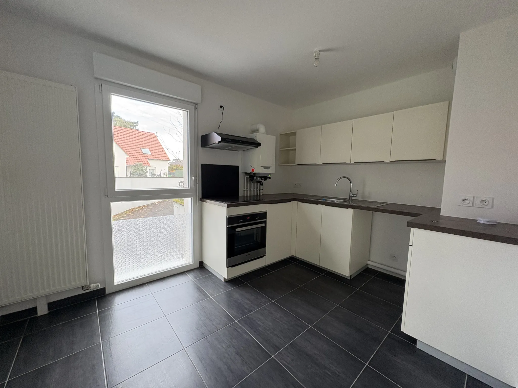 Appartement F2 en rez-de-jardin à Kembs avec jardin et garage 