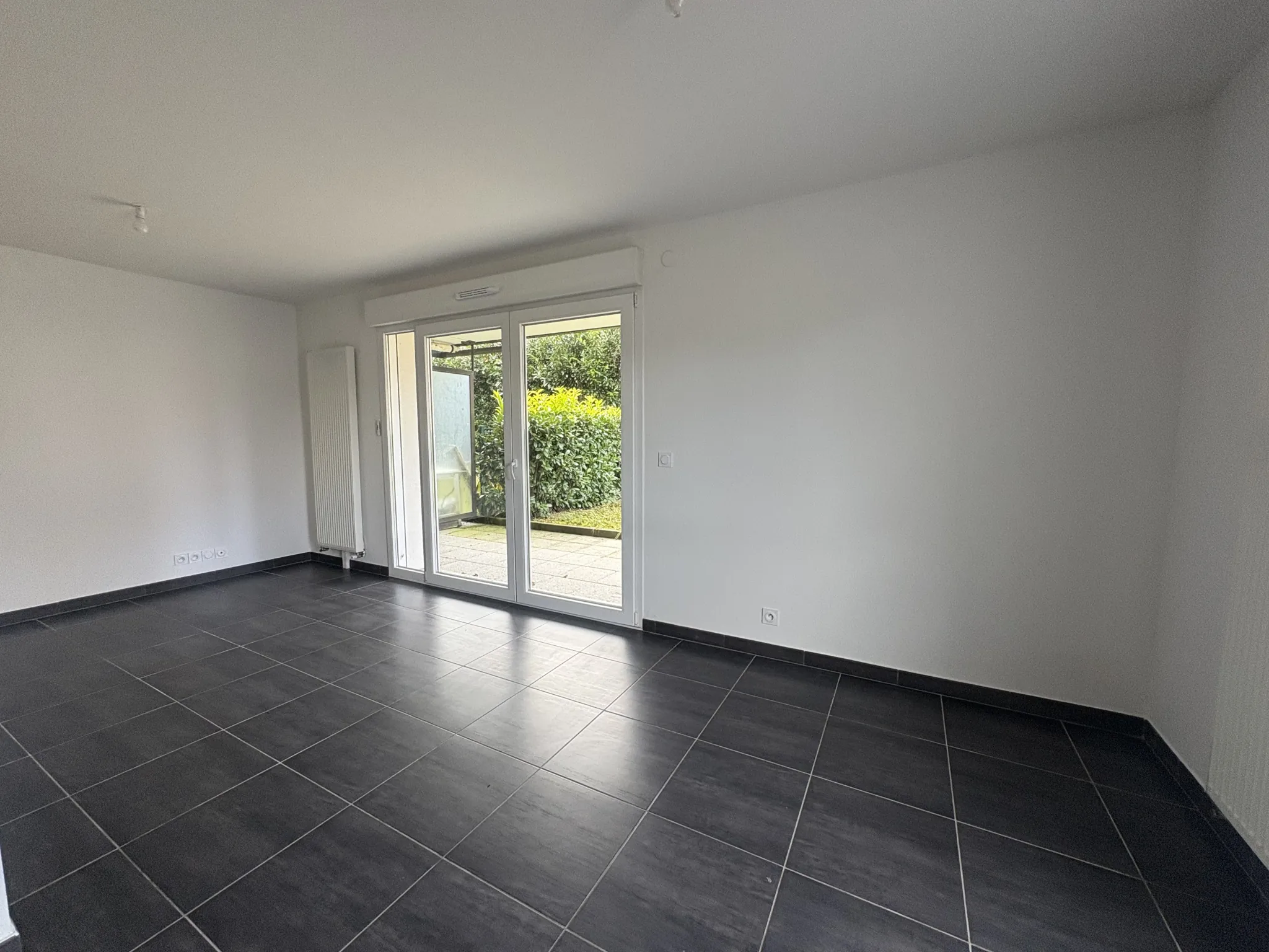 Appartement F2 en rez-de-jardin à Kembs avec jardin et garage 