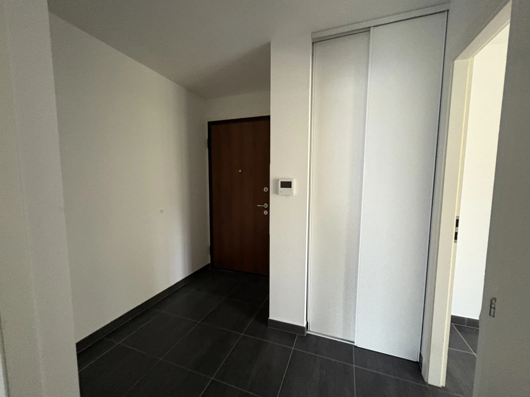 Appartement F2 en rez-de-jardin à Kembs avec jardin et garage 