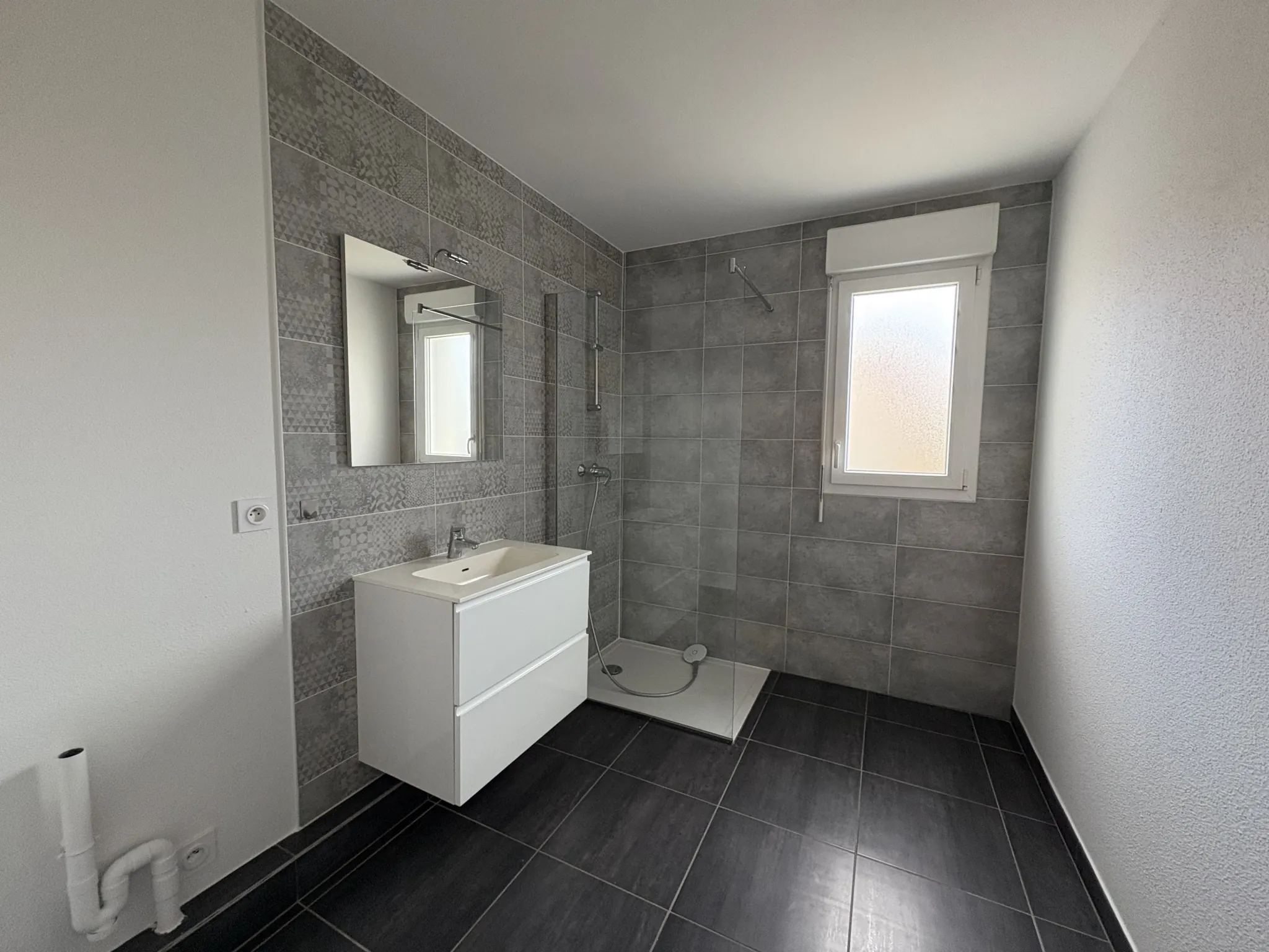 Appartement F2 en rez-de-jardin à Kembs avec jardin et garage 