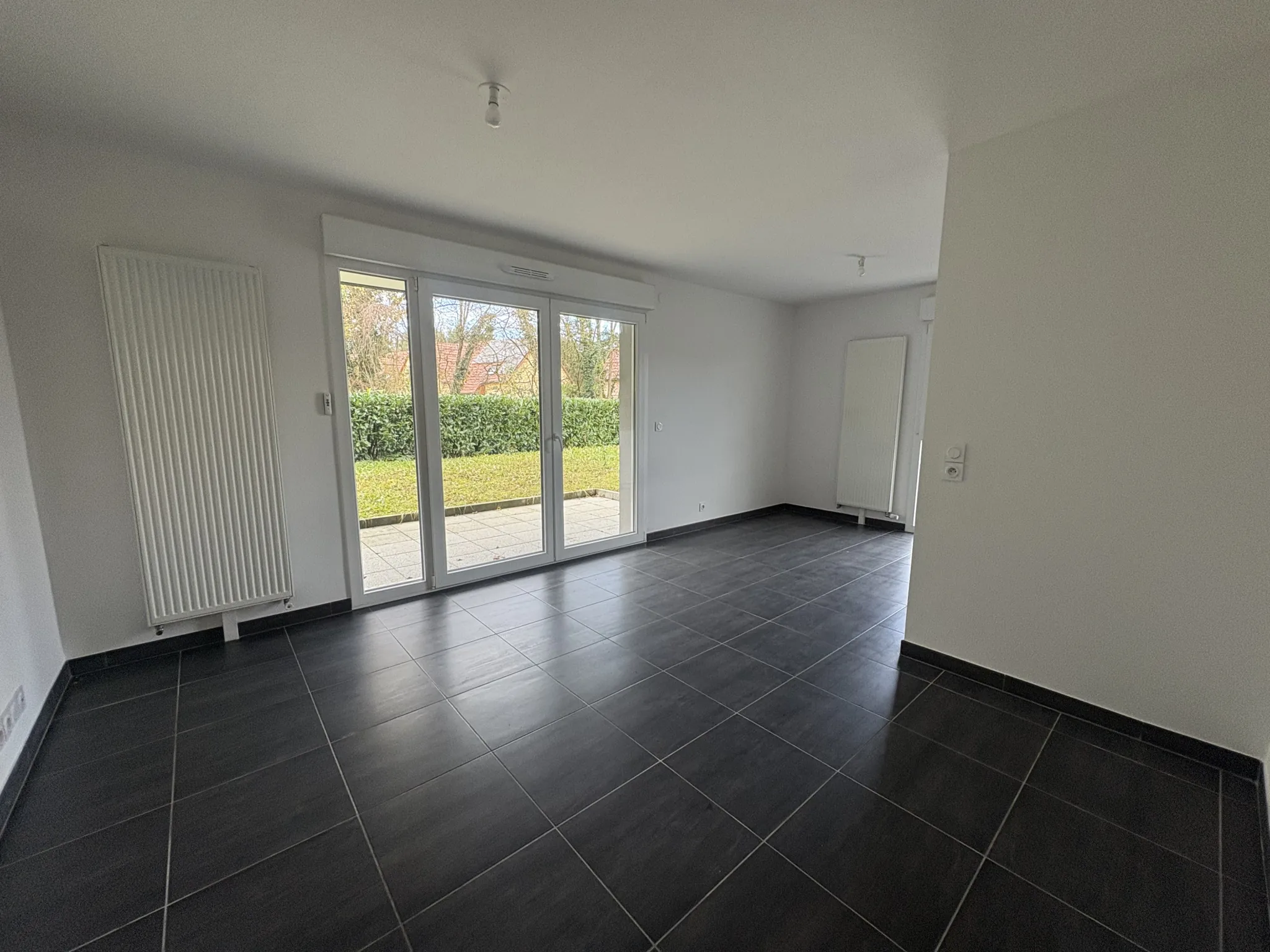 Appartement F2 en rez-de-jardin à Kembs avec jardin et garage 