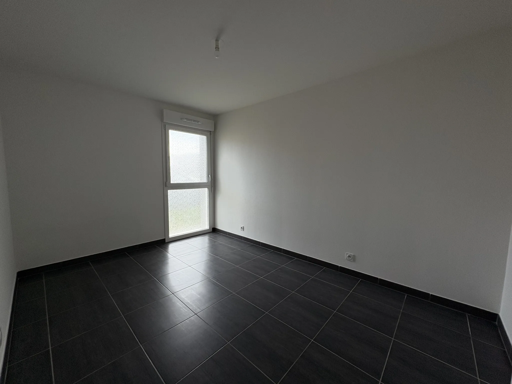 Appartement F2 en rez-de-jardin à Kembs avec jardin et garage 