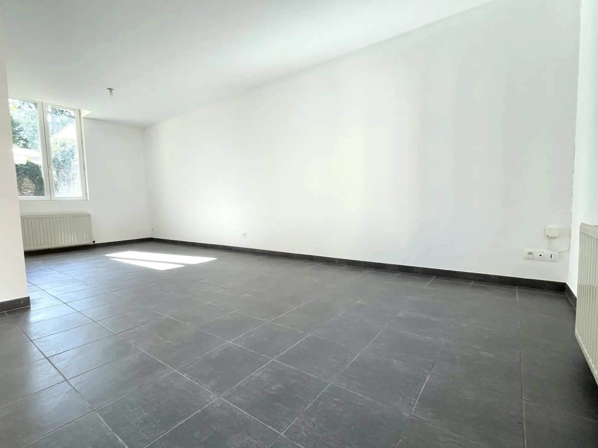 Maison 2 chambres à Saint-Quentin, quartier Saint-Jean avec terrasse et cave 