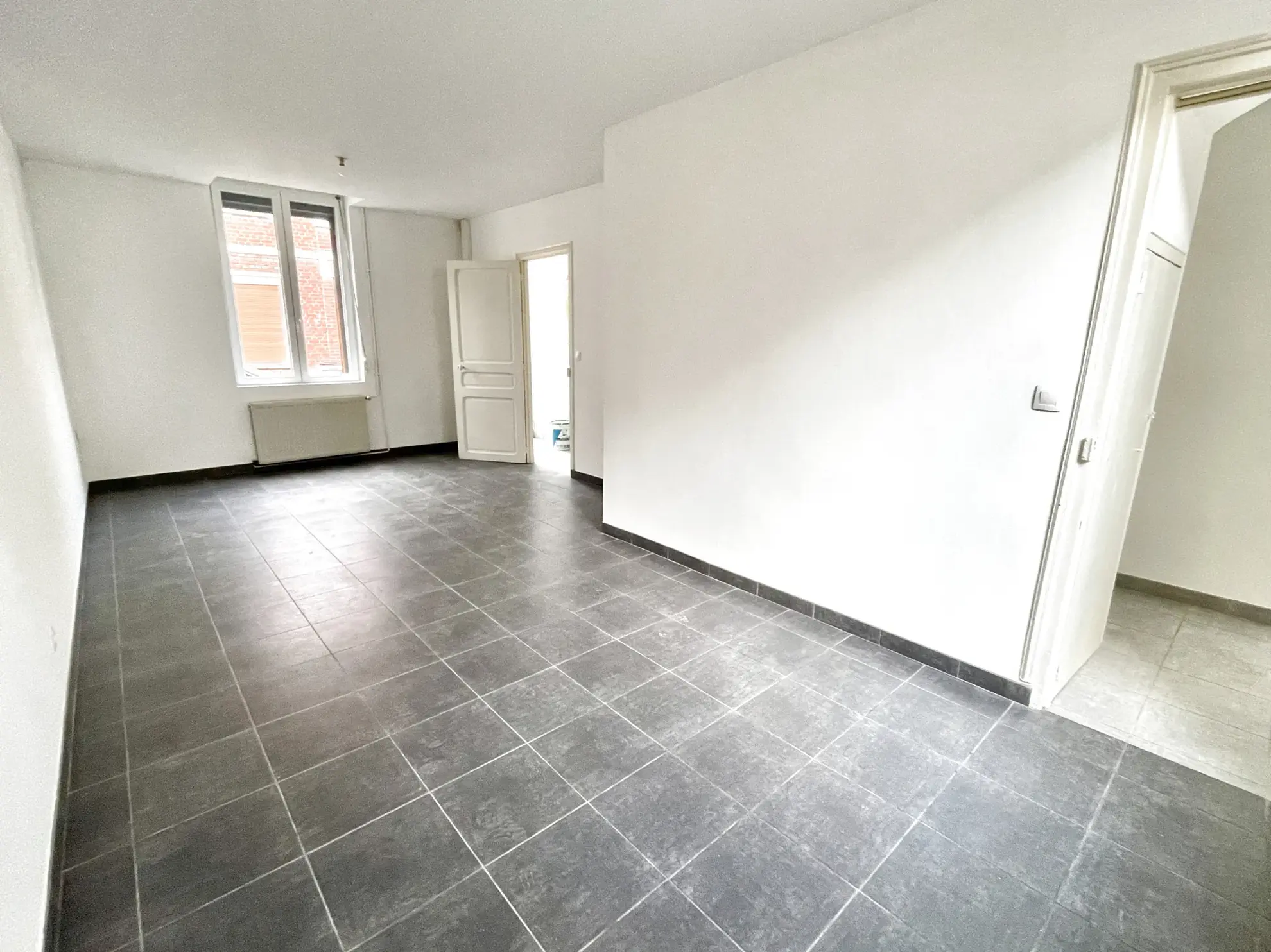 Maison 2 chambres à Saint-Quentin, quartier Saint-Jean avec terrasse et cave 