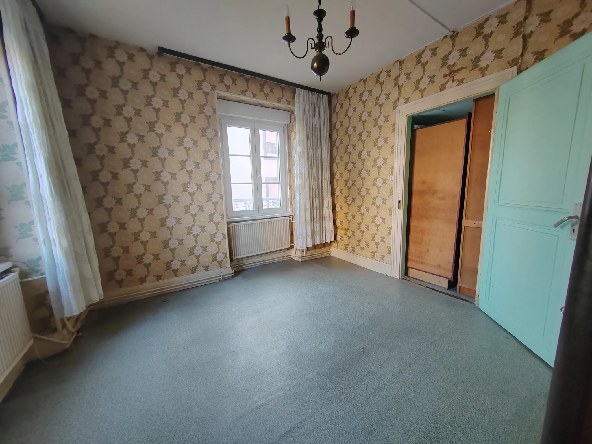 Maison bi-familiale à Riedisheim avec deux appartements, garage et jardin 