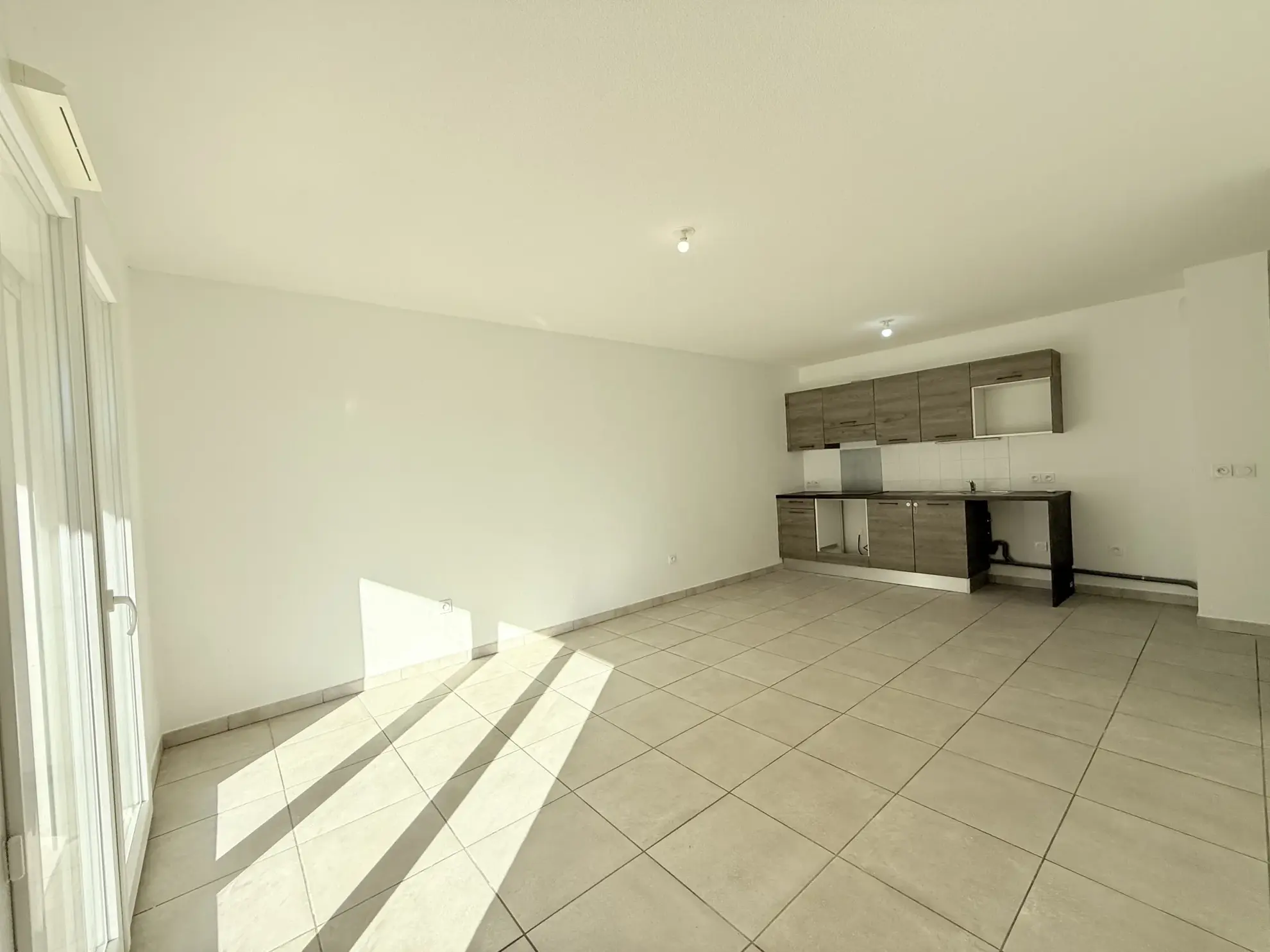 Appartement T3 avec jardin, terrasse et garage à Lunel – 63 m² 
