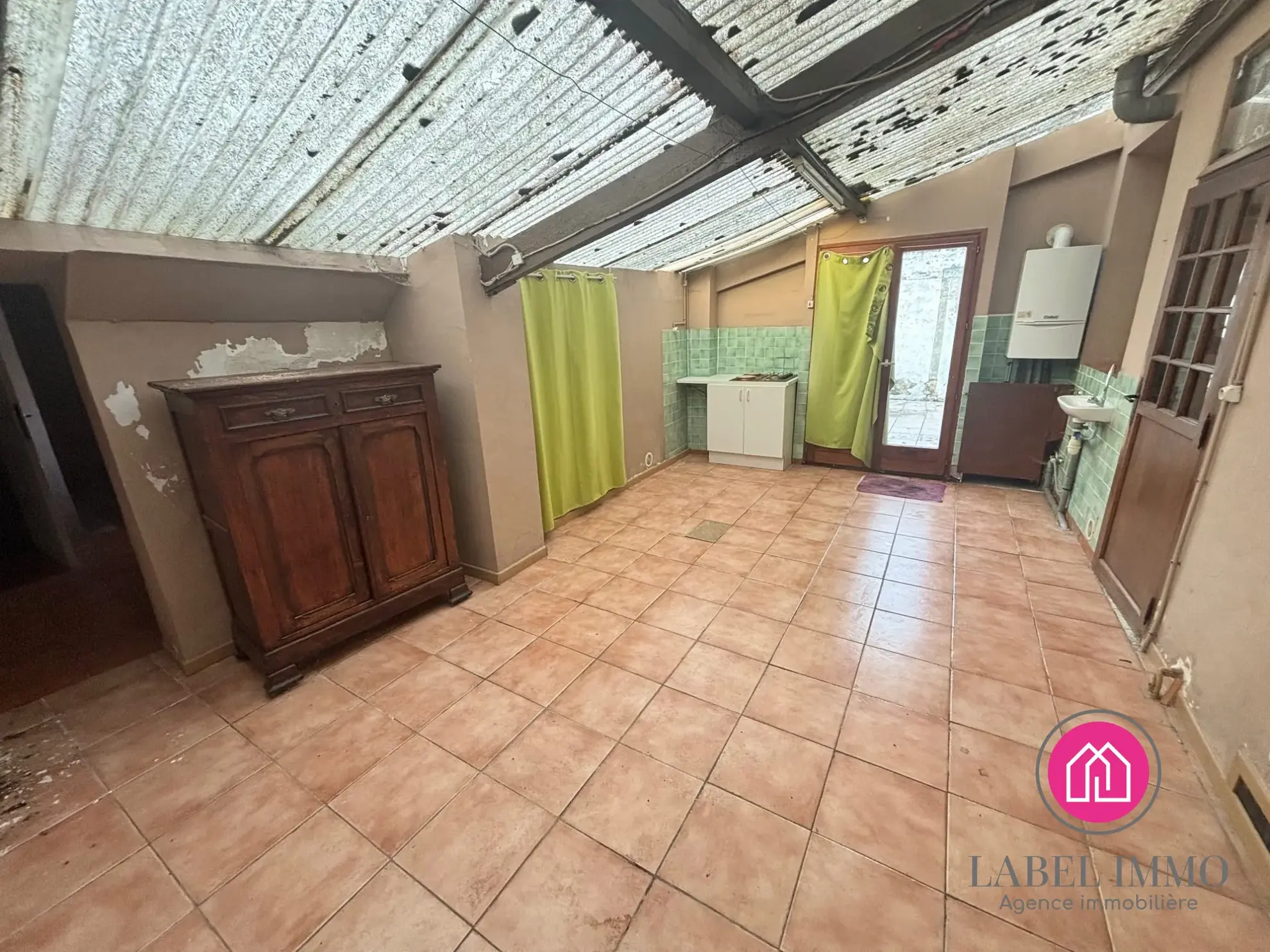 Maison mitoyenne à Fresnes-sur-Escaut avec garage et jardin