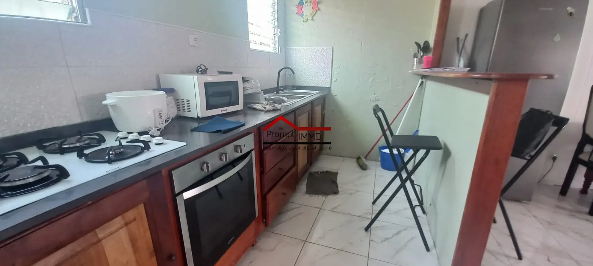 Maison T3 à Fort de France avec jardin, garage sécurisé et location en cours 