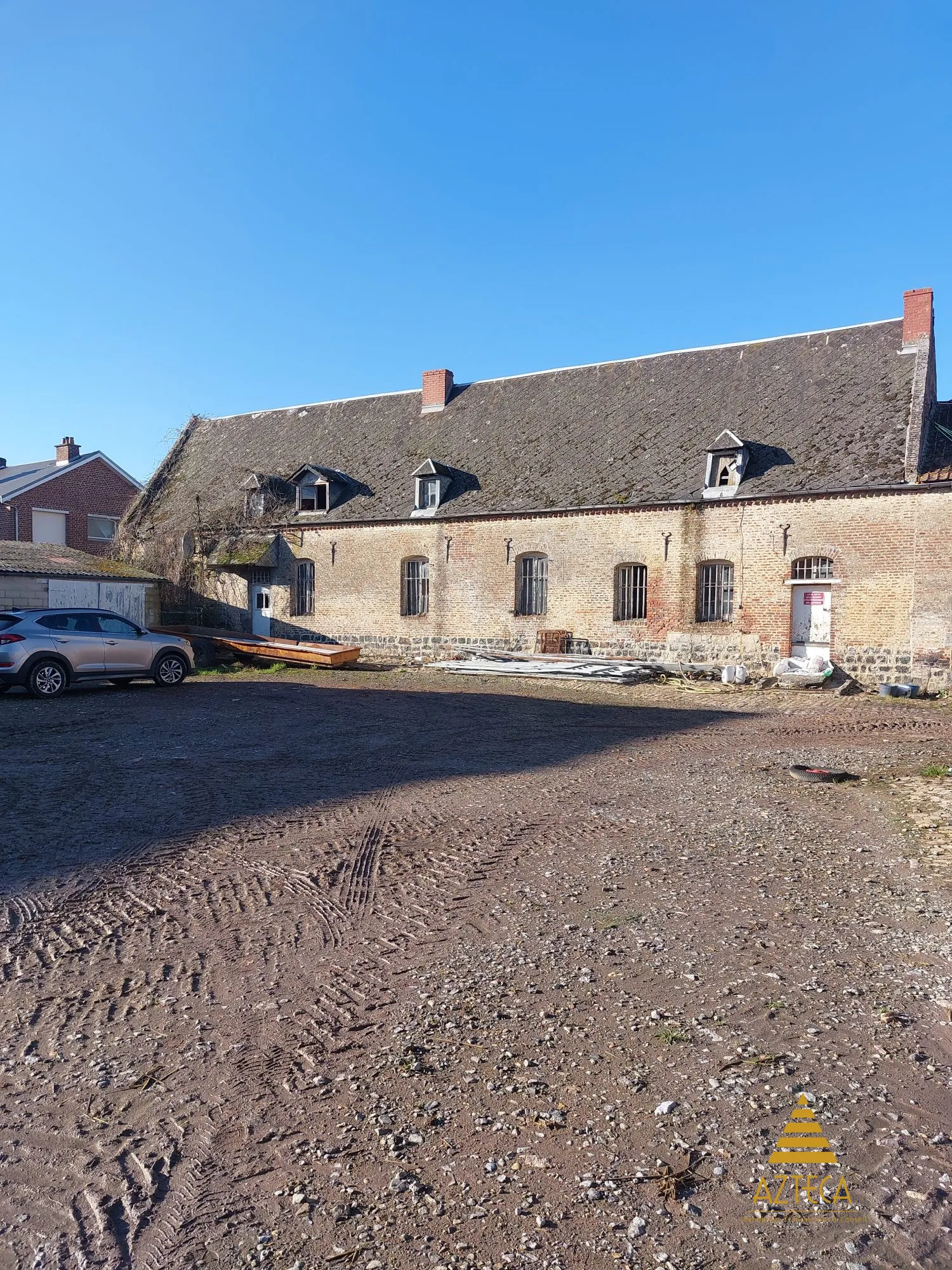 Corps de ferme à vendre à Busigny avec potentiel et grand terrain 