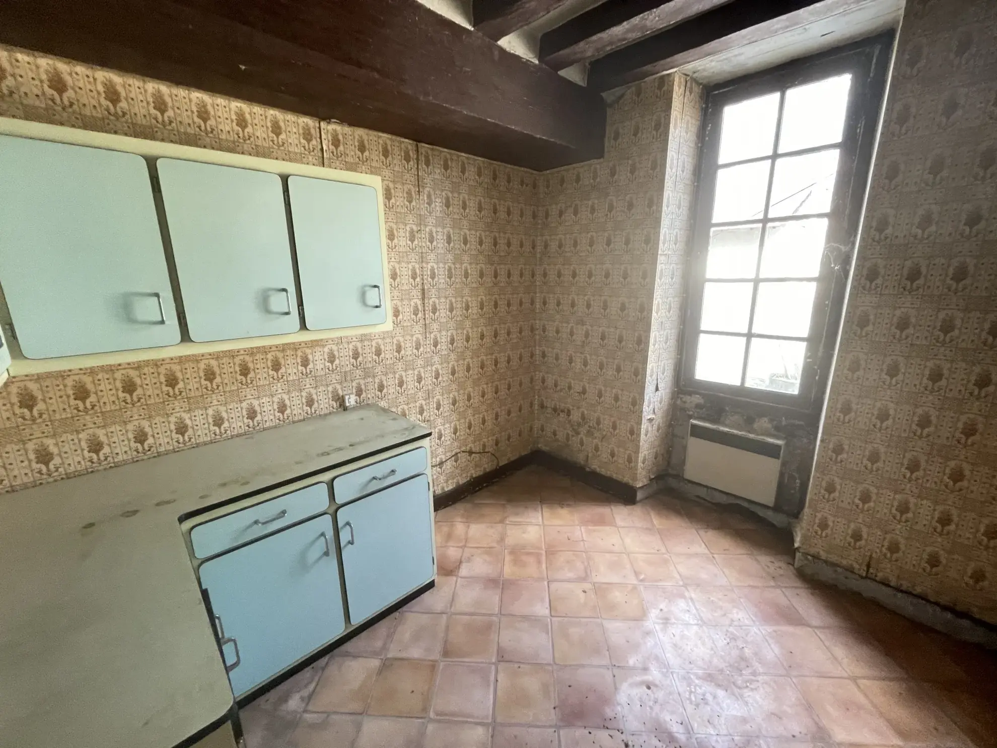 Immeuble ancien à rénover au centre-ville de Baugé – Opportunité d'investissement 