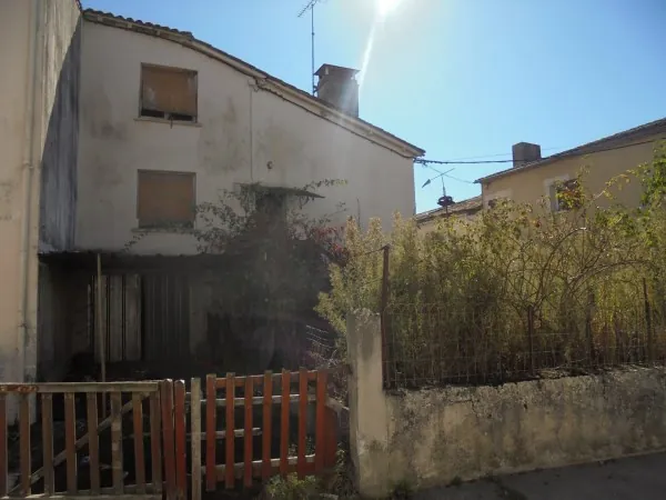 Ensemble immobilier avec deux maisons, garage et jardin à La Réole 