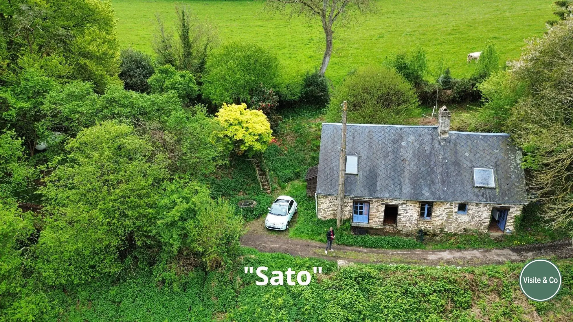 Maison à rénover à Putanges-le-Lac avec grand terrain et potentiel naturel