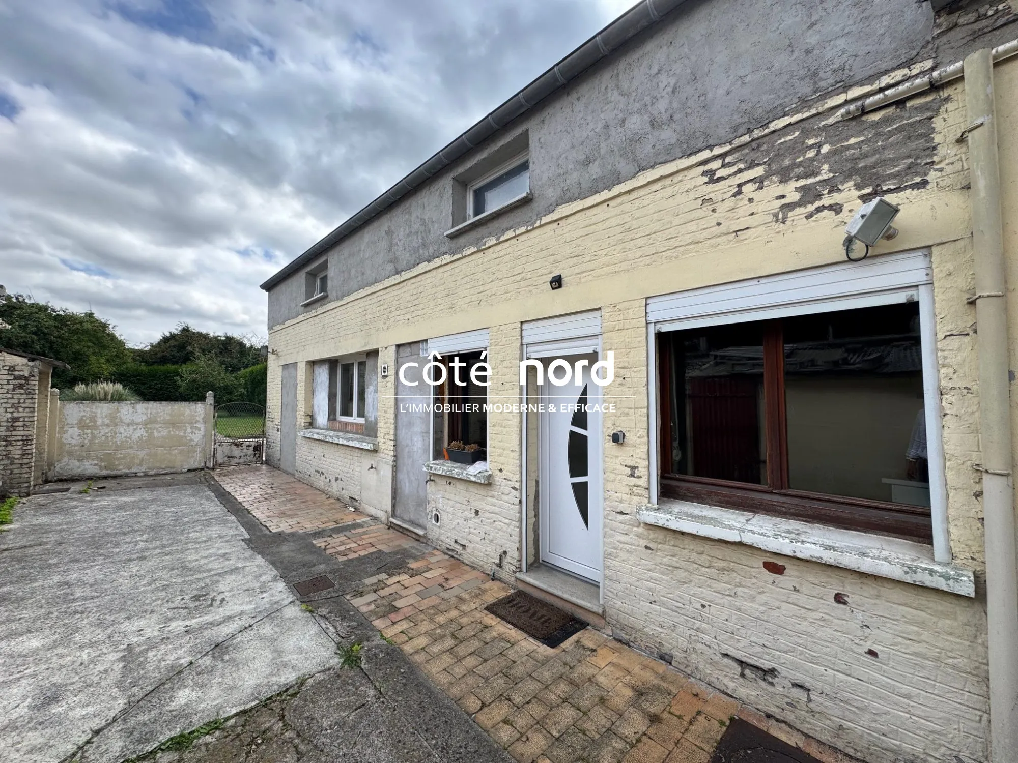 Maison à vendre à Caudry : longère avec jardin et dépendance 