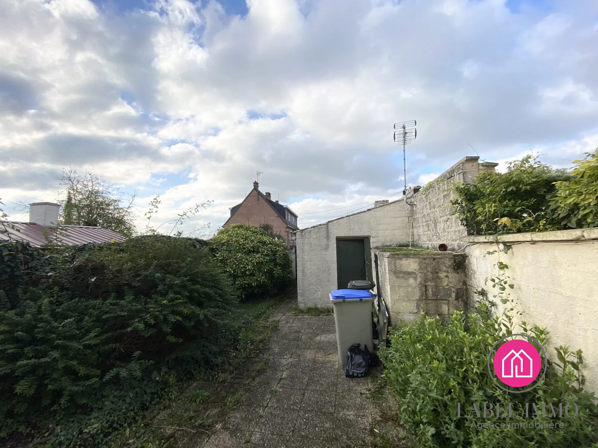 Maison à rénover à Marquette-en-Ostrevant avec jardin et dépendance 