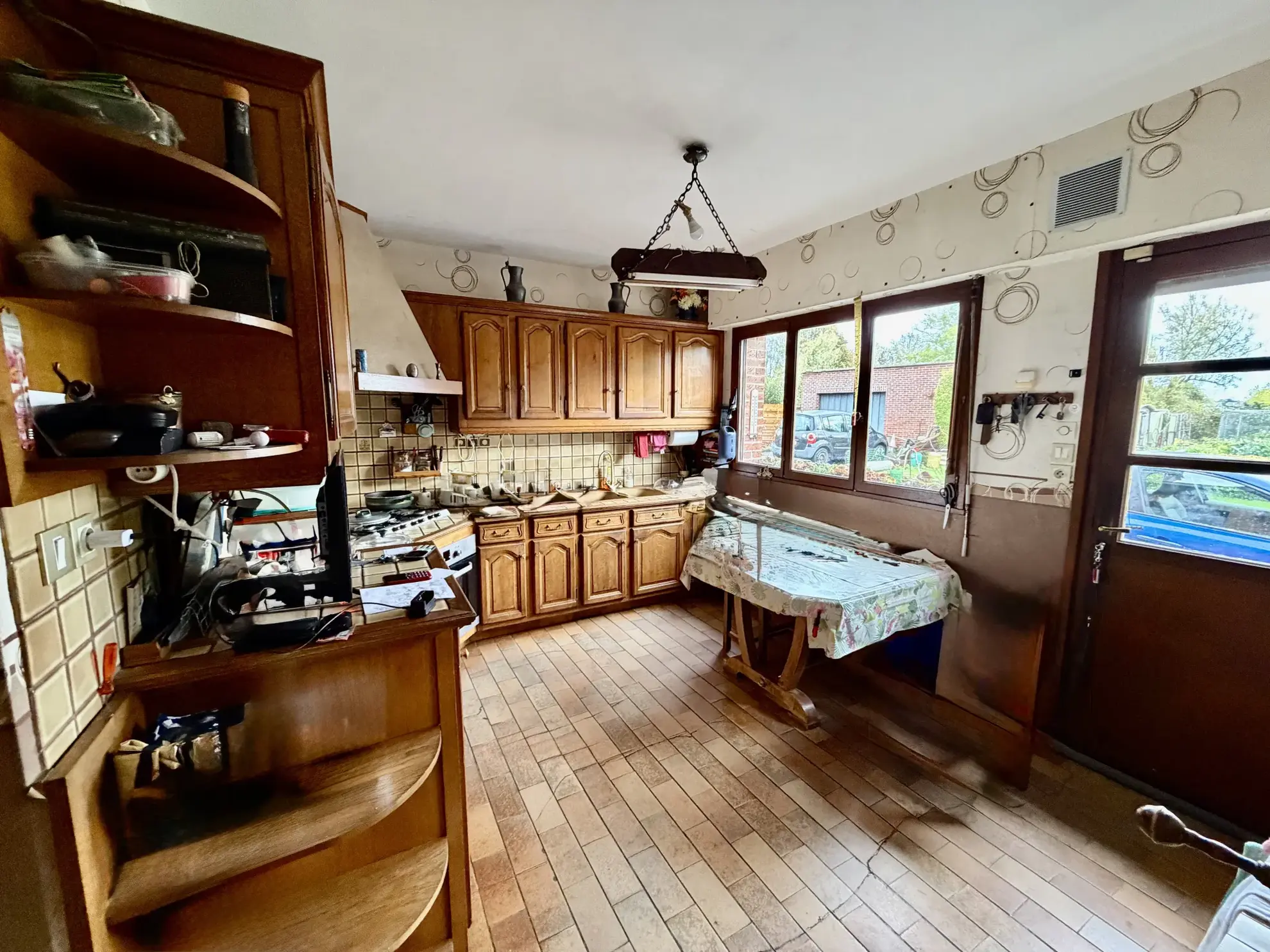 Maison familiale à Wallers avec grand terrain et garage - Potentiel à exploiter 