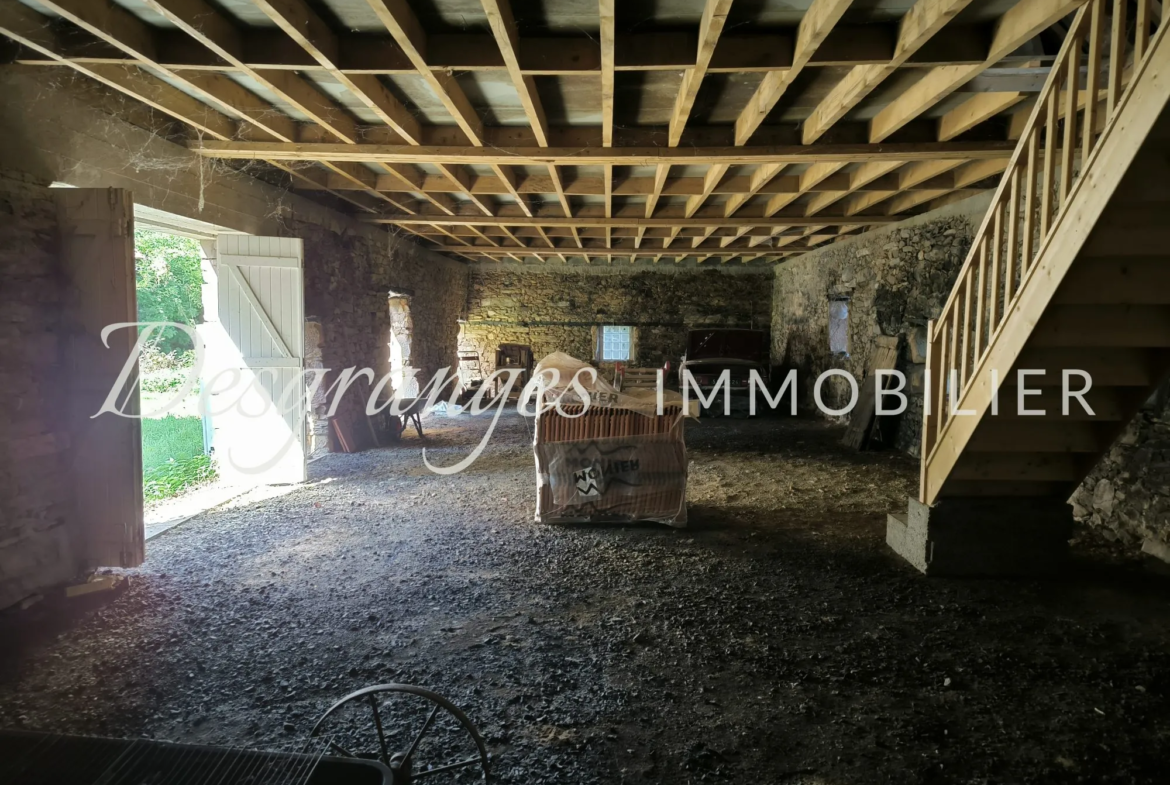 Propriété authentique avec vues dégagées et grandes granges à Génès 