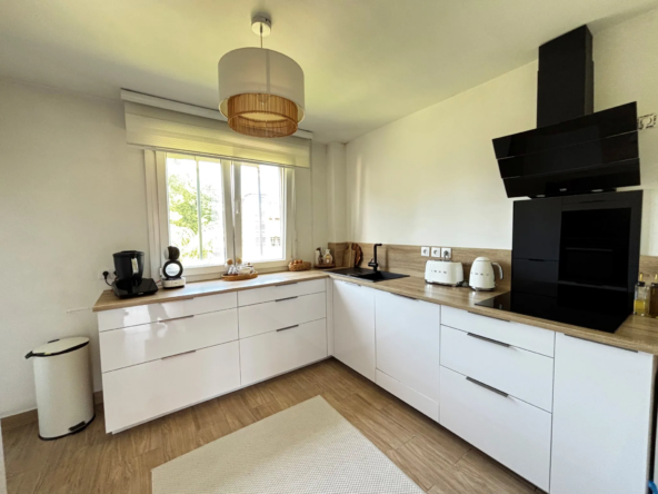 Appartement rénové avec garage, balcon et véranda à Belfort - 76 m²
