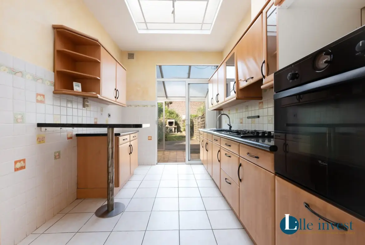 Maison à vendre à Mons-en-Barœul – Maison ancienne avec jardin et potentiel rénové 