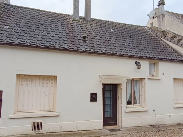 Maison à rénover avec dépendances, garage et jardin dans le hameau de Baillon