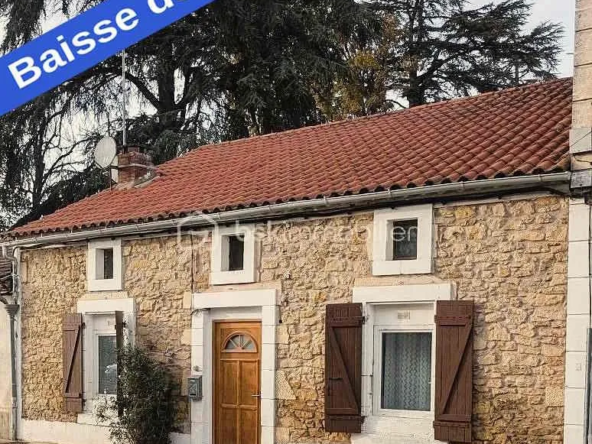 Maison en pierre de plain pied à Saint-Vite avec jardin et garage