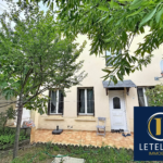 Maison mitoyenne à Le Petit-Quevilly avec jardin et garage, opportunité de rénovation