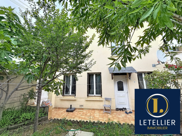 Maison mitoyenne à Le Petit-Quevilly avec jardin et garage, opportunité de rénovation