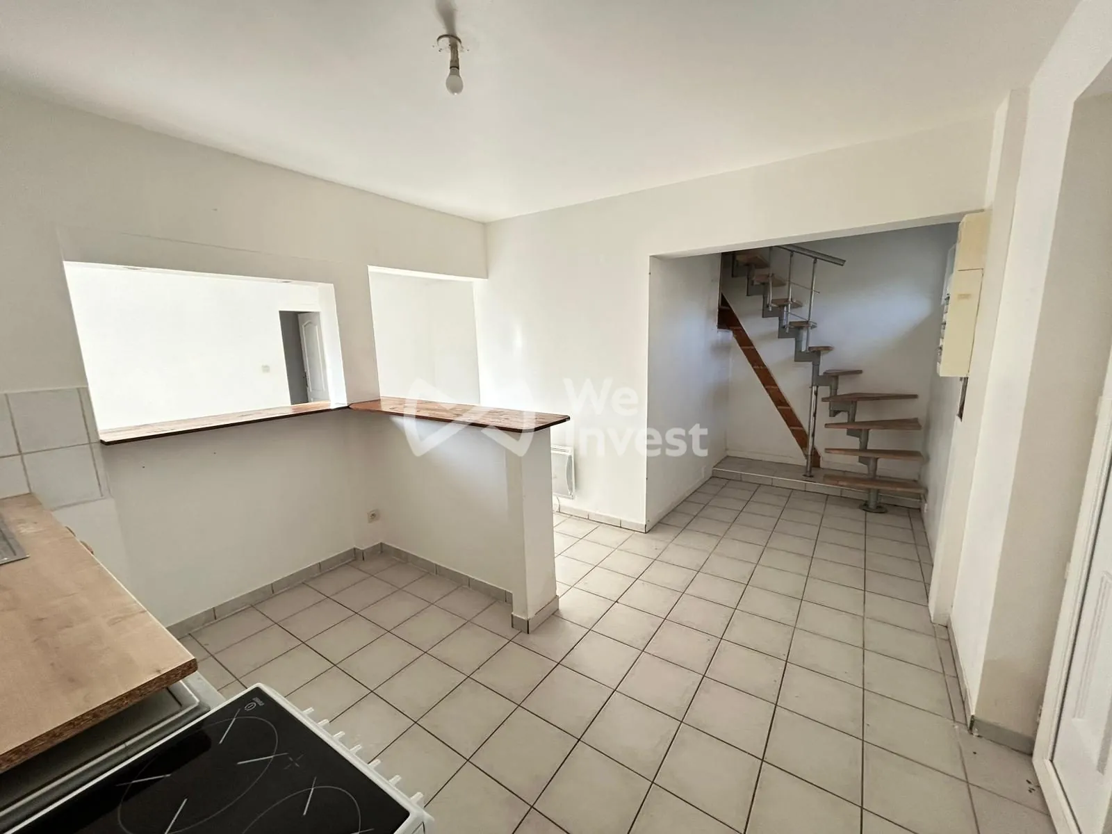 Maison à vendre à Auxerre avec terrain constructible et potentiel locatif élevé 