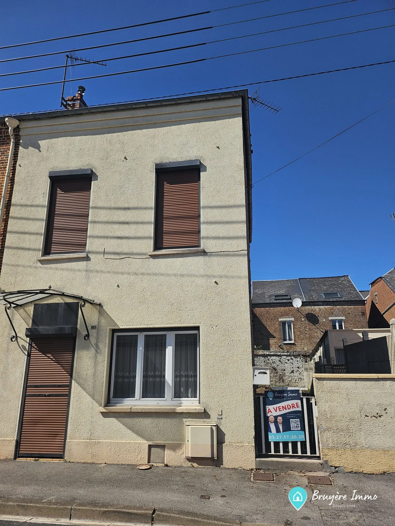 Maison semi individuelle à vendre à Fourmies avec véranda et potentiel d'aménagement