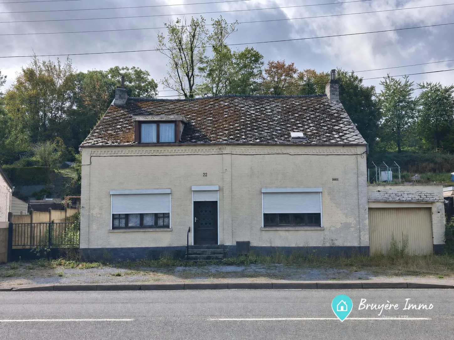 Maison à vendre à Fourmies avec jardin, garage et potentiel de rénovation