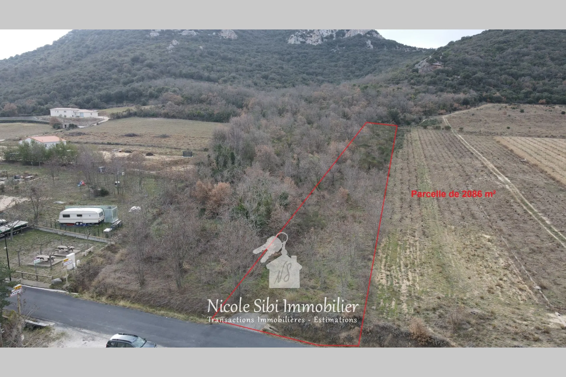 Terrain agricole arboré de 2086 m² à Lansac, idéal pour projets d'arboriculture ou de loisirs
